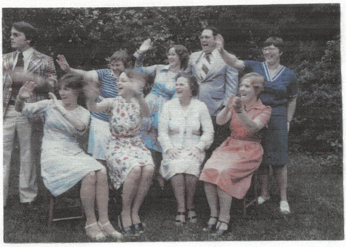 The eight Leusch siblings, waving — from the cover of Aunt Laura's original cookbook